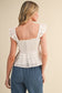 Mia Eyelet Flutter Sleeve Peplum Top